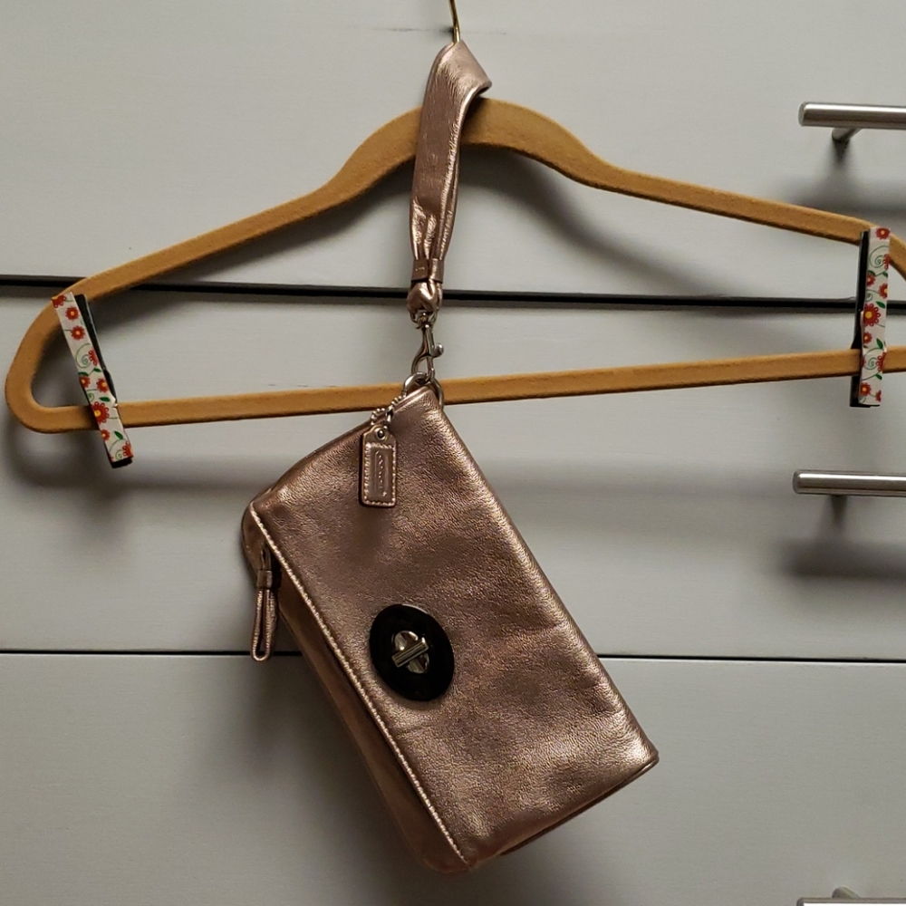 Coach metalic leather wristlet in rose gold